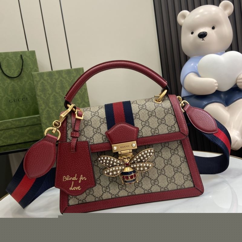G*u*i top handle bags